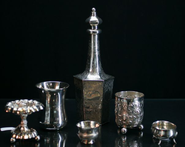 Appraisal: A continental silver repousse decorated footed cup together with a