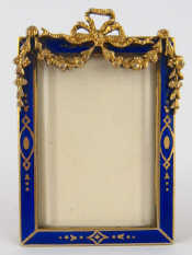 Appraisal: A silver and blue enamel photo frame Vienna import marks