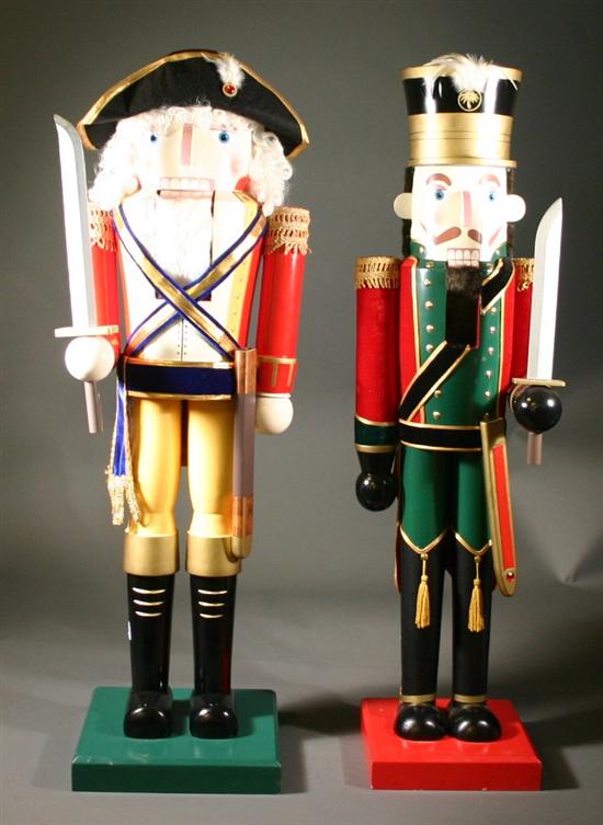 Appraisal: Two guard nutcrackers Having square bases One in a red