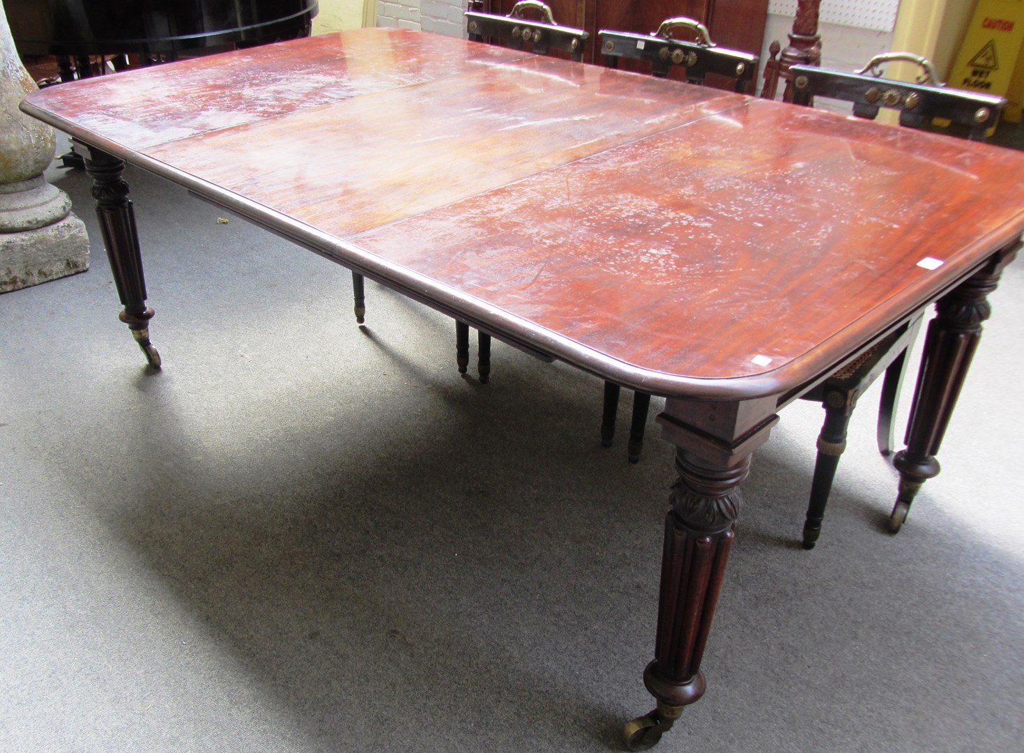 Appraisal: A George IV mahogany extending dining table on tapering reeded