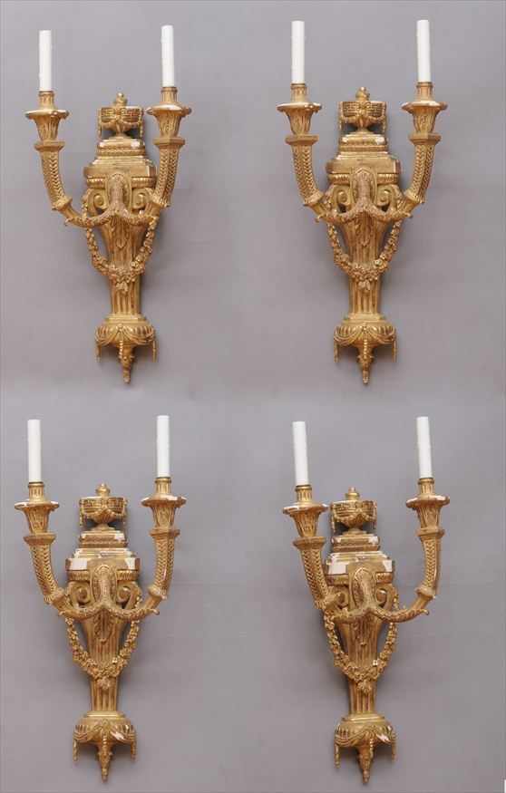 Appraisal: SET OF FOUR LOUIS XVI STYLE CARVED GILTWOOD TWO-LIGHT BRAS