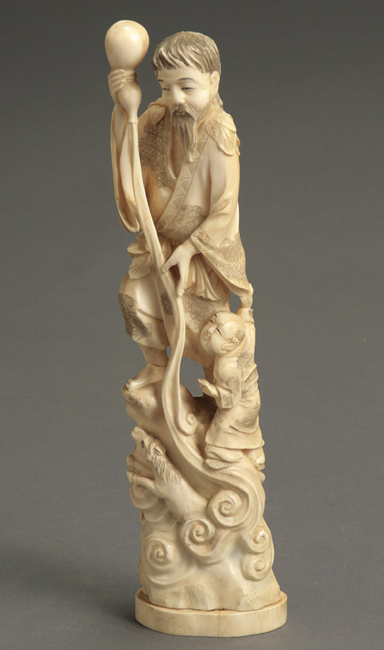 Appraisal: Japanese Ivory Okimono of Lohan with a Boy Signed Kyogoku