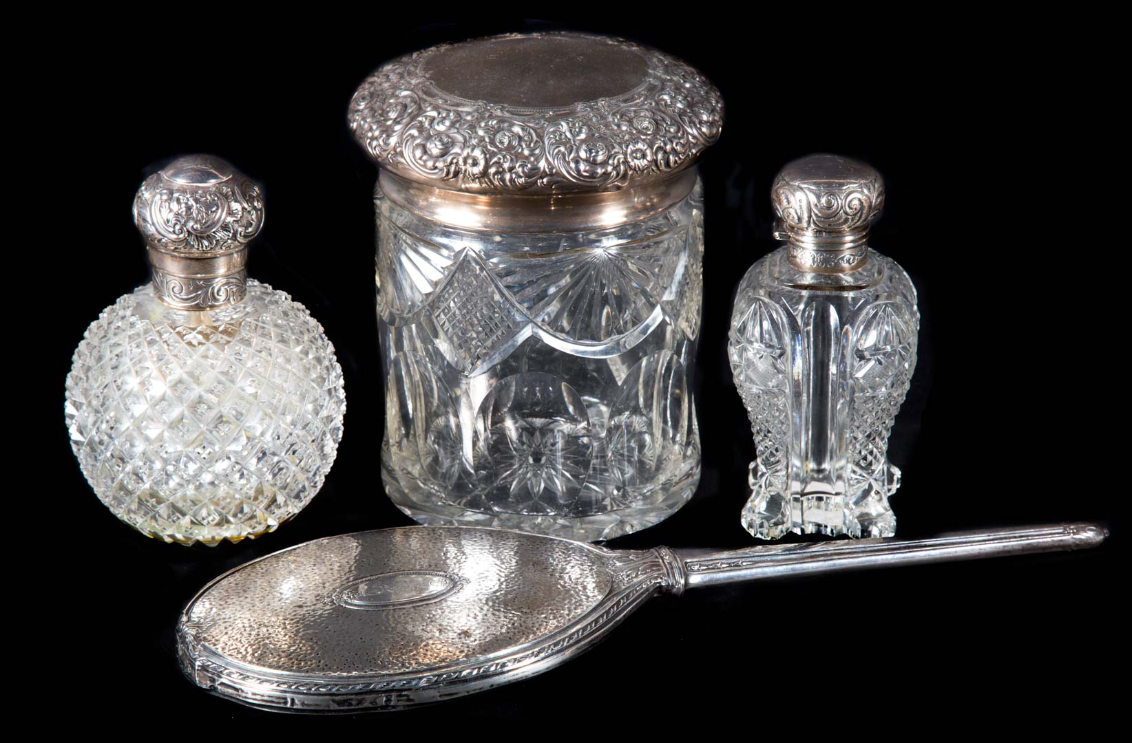 Appraisal: English sterling mounted cut glass scent bottles comprising two scent