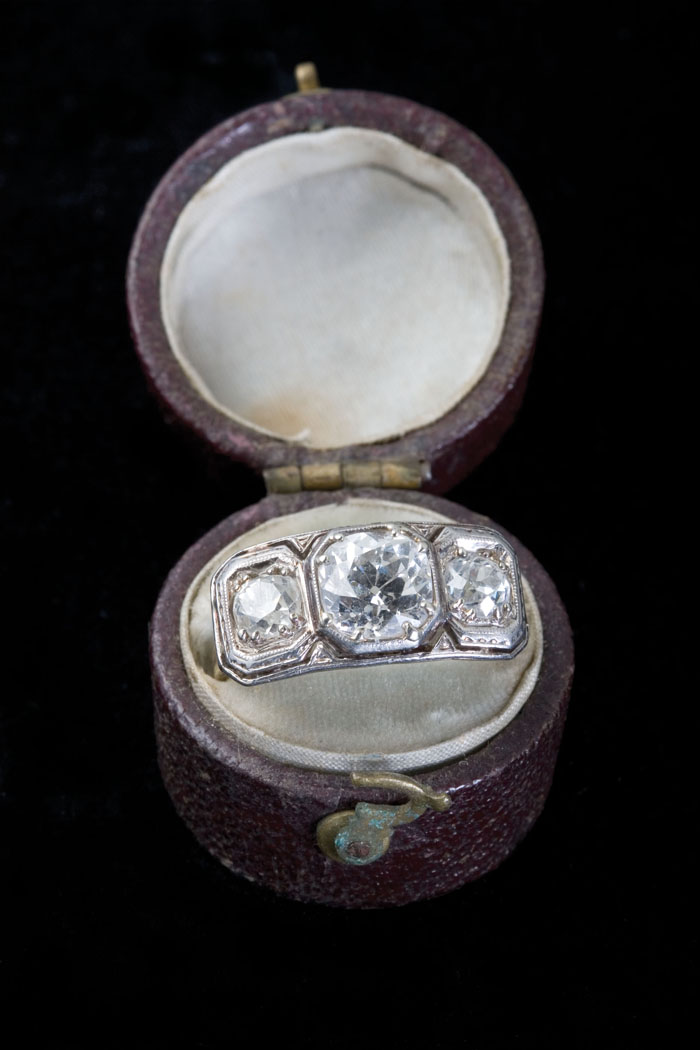 Appraisal: DIAMOND AND GOLD THREE STONE RING The pierced yellow and