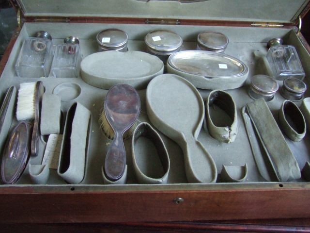 Appraisal: A French part dressing set comprising three glass bottles five