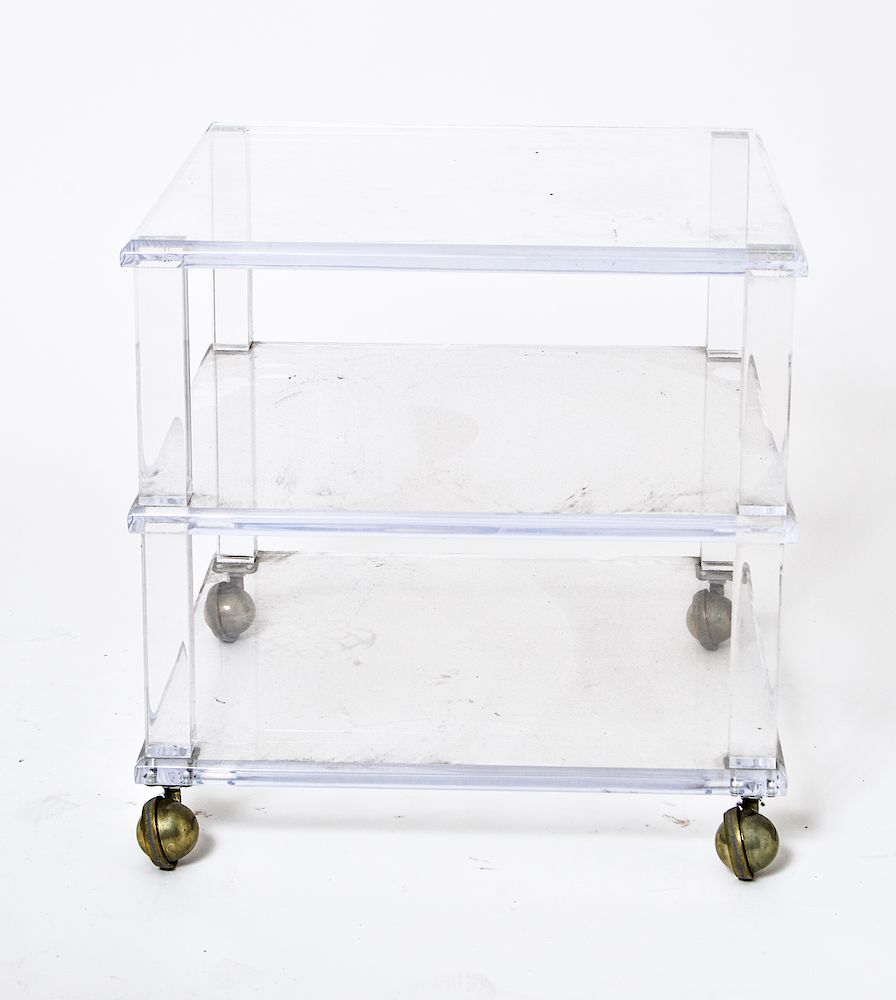 Appraisal: Lucite Three-Tiered Side Table on Casters Lucite three-tiered side table