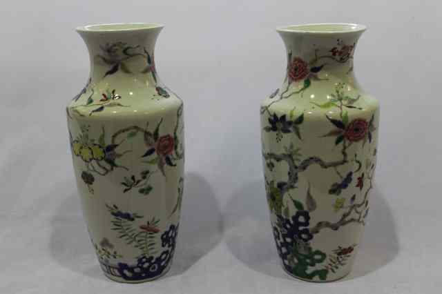 Appraisal: A PAIR OF CHINESE WHITE GROUND PORCELAIN VASES each decorated