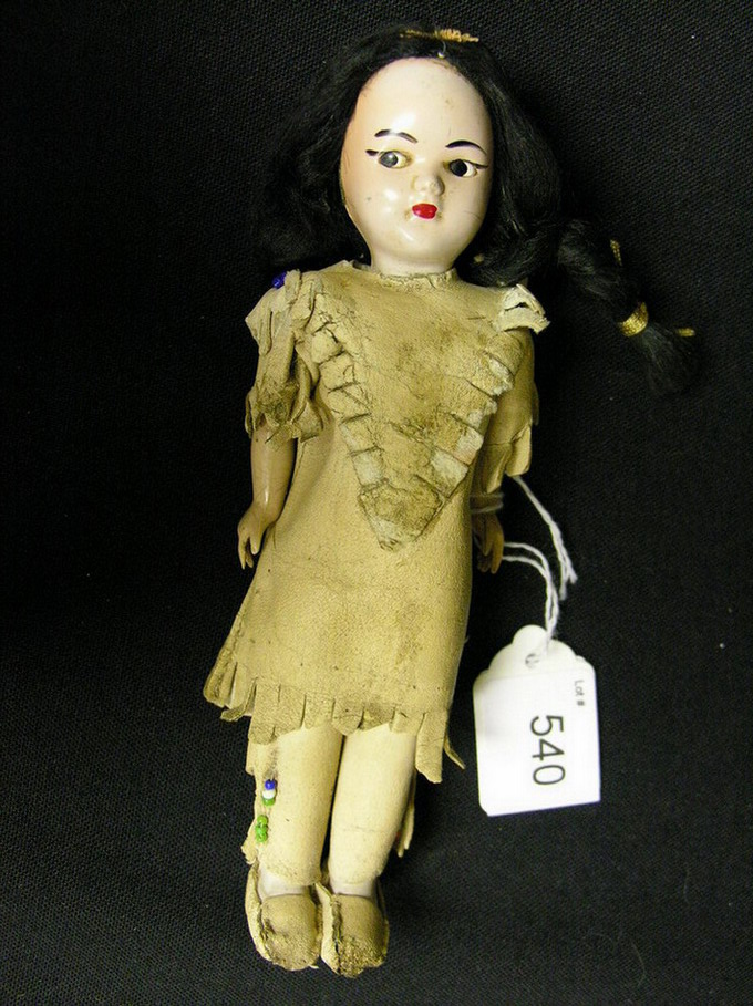 Appraisal: NATIVE AMERICAN TOURIST SHOP DOLL Hard plastic head and limps