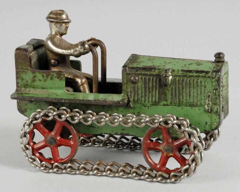 Appraisal: Cast Iron Arcade Tractor Toy Description American Original chains and