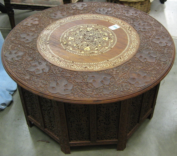 Appraisal: CARVED AND INLAID TEAKWOOD COCKTAIL TABLE Kashmir India mid th