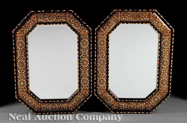 Appraisal: A Pair of Hispano Moresque-Style Inlaid Mirrors the octagonal frames