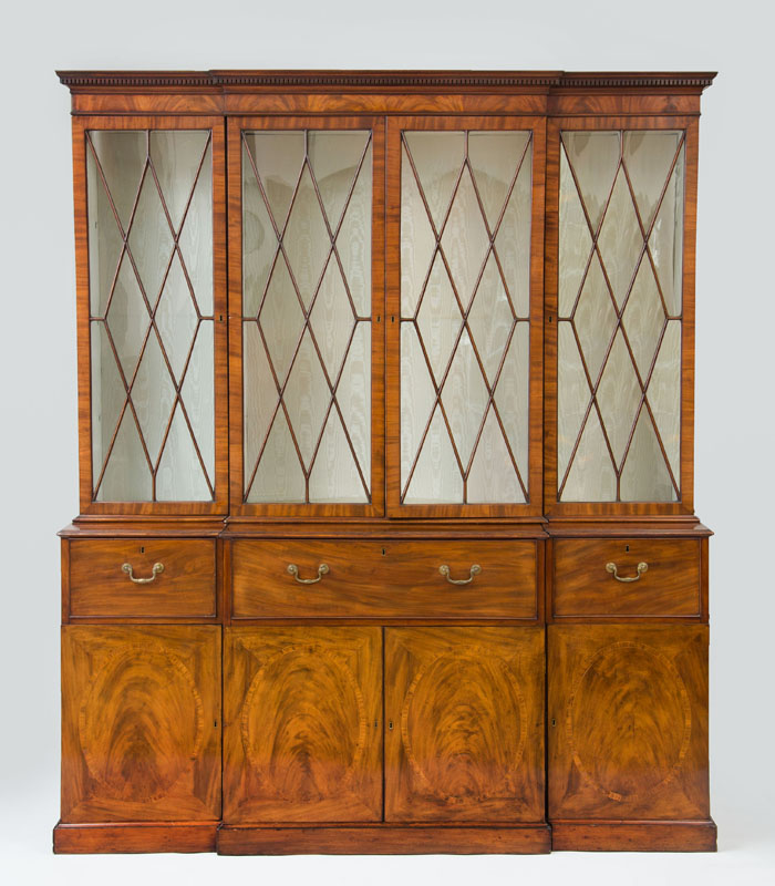 Appraisal: GEORGE III INLAID MAHOGANY BREAKFRONT BOOKCASE The projecting dentil molded