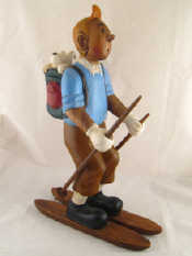 Appraisal: A painted hardwood carving of Tintin on skis his dog