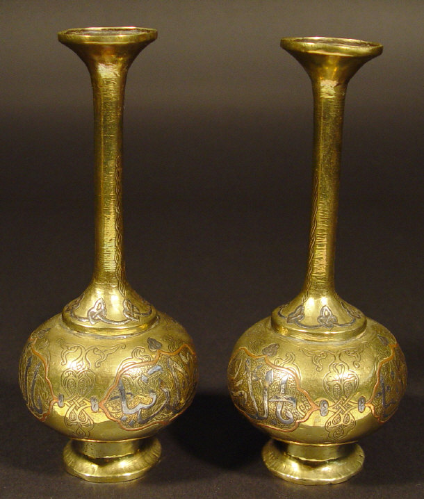 Appraisal: Pair of Persian brass bottle vases with silver metal and