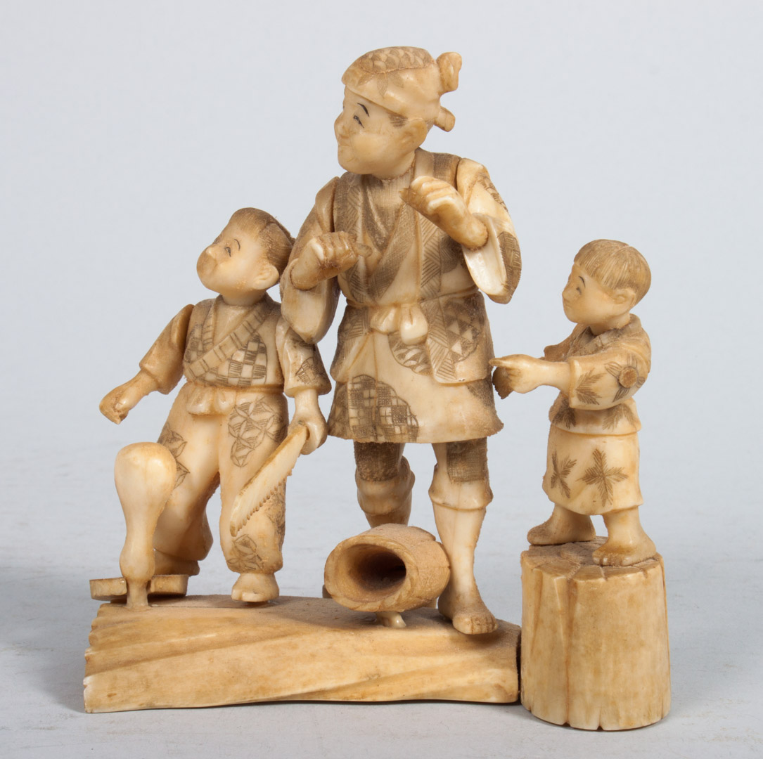 Appraisal: Japanese carved ivory figural group modeled as fisherman with children