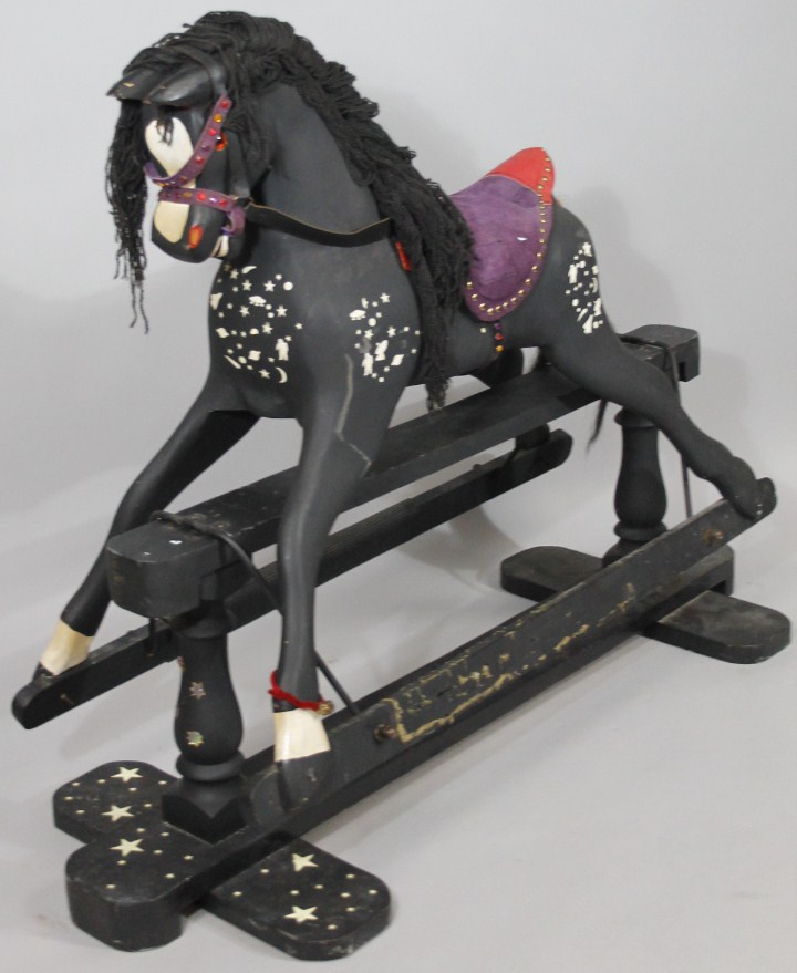 Appraisal: A thC rocking horse in black with white highlights and