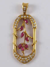 Appraisal: A yellow metal tests carat gold ruby and diamond pendant