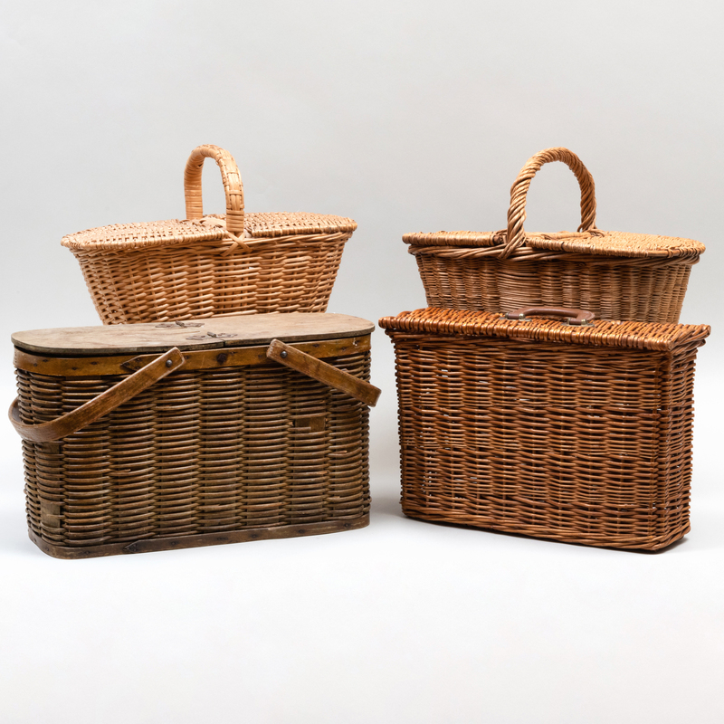 Appraisal: FOUR WOVEN PICNIC BASKETS One with metal liner The largest