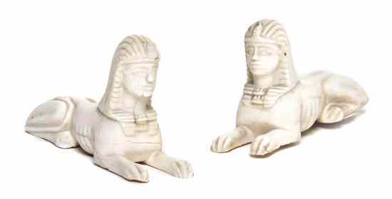 Appraisal: A Pair of Carved Ivory Sphinxes each in a typical