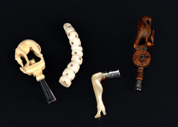 Appraisal: Three th or th century pipe tampers the first ivory