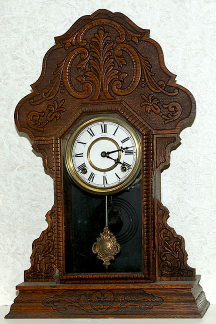 Appraisal: Oak Kitchen Clock A sessions oak kitchen clock with key