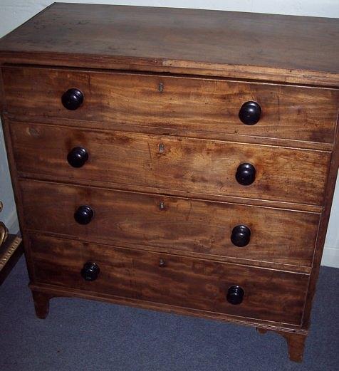 Appraisal: A George III mahogany chest of four long drawers on