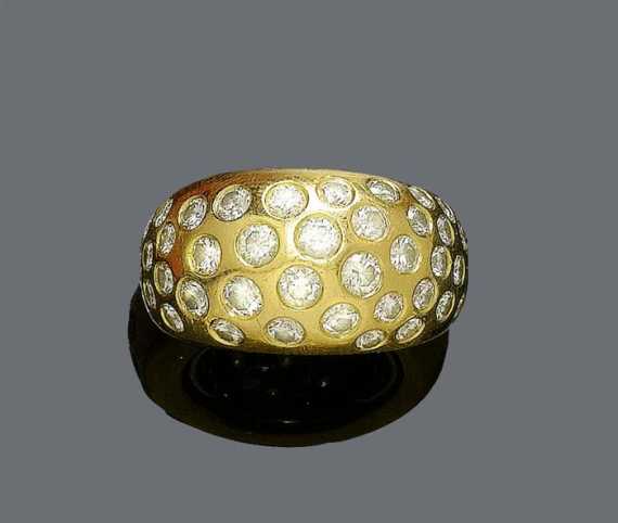 Appraisal: GOLD AND DIAMOND RING Yellow gold g Casual-elegant solid band