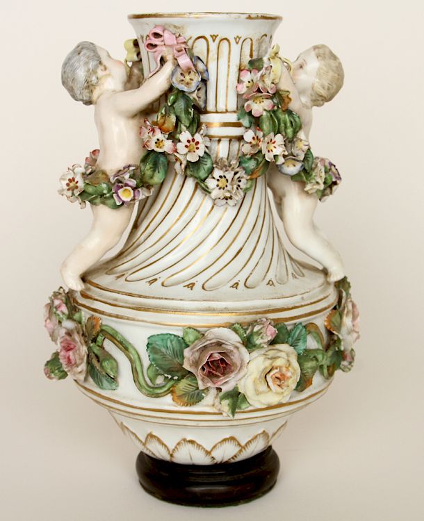 Appraisal: CONTINENTAL POLYCHROME PORCELAIN VASE WOOD BASE A Continental polychrome porcelain