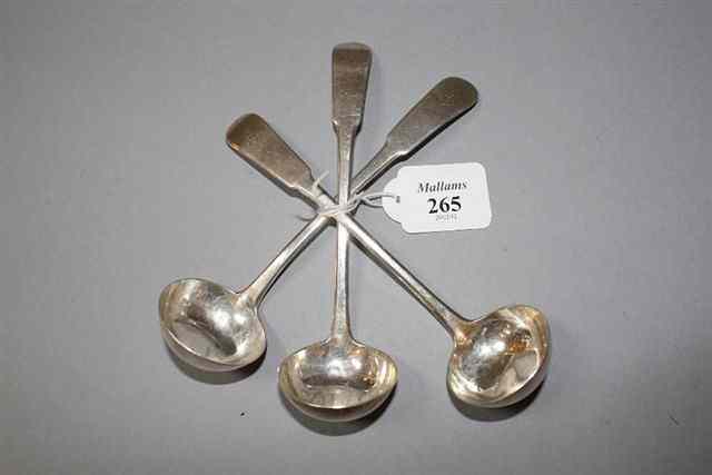 Appraisal: A SET OF THREE SCOTTISH PROVINCIAL TODDY LADLES with paddle