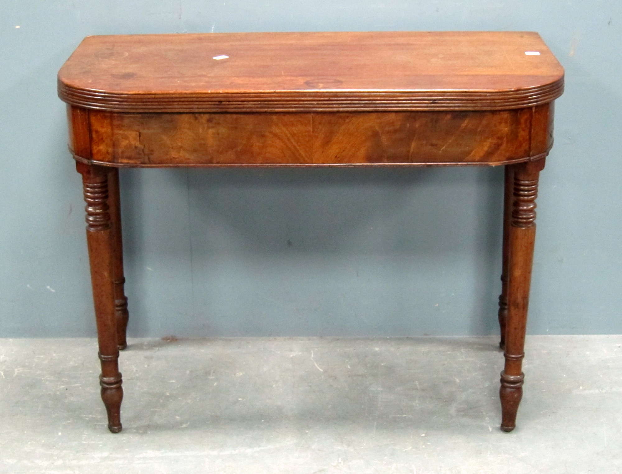 Appraisal: Mahogany tea table on turned legs