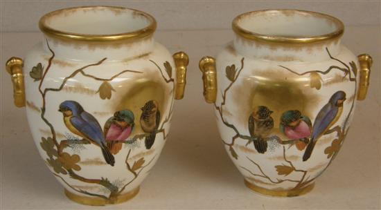 Appraisal: Pair of Victorian porcelain vases decorated with birds highlighted in