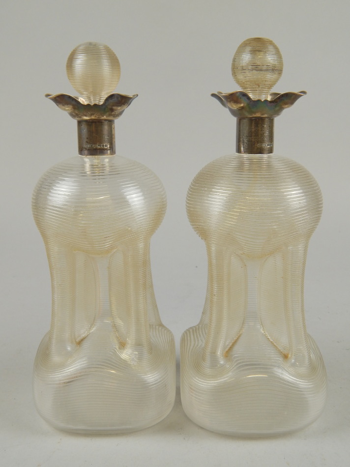 Appraisal: A pair of Edwardian cut glass decanters and stoppers each