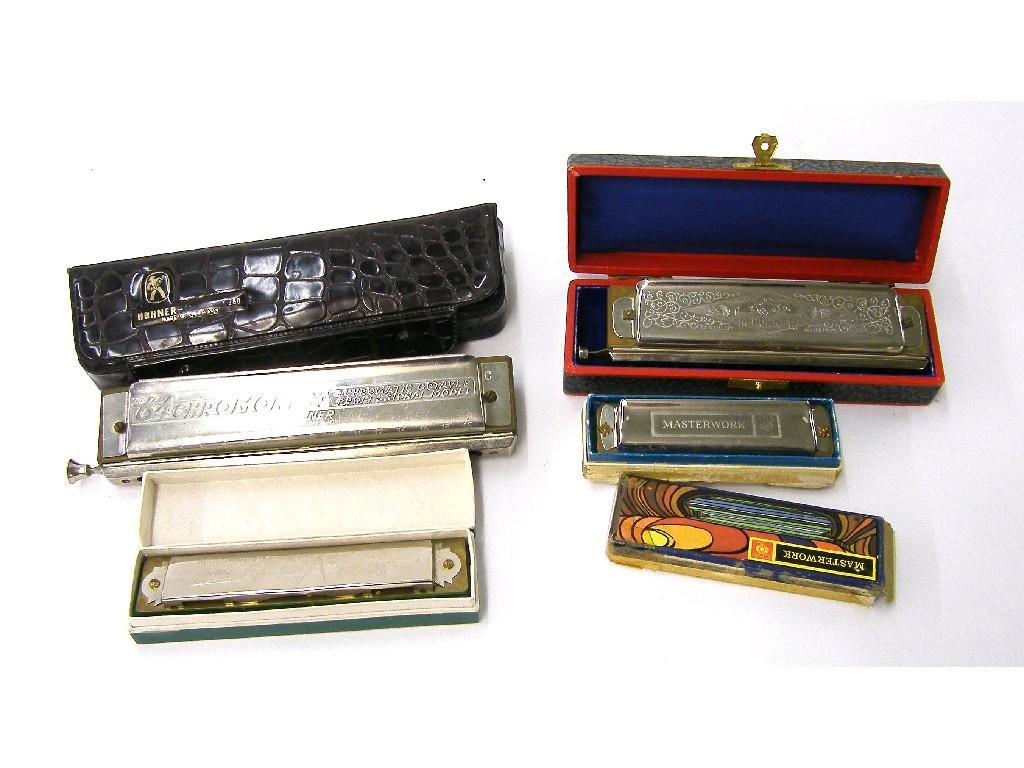 Appraisal: Four various cased harmonicas