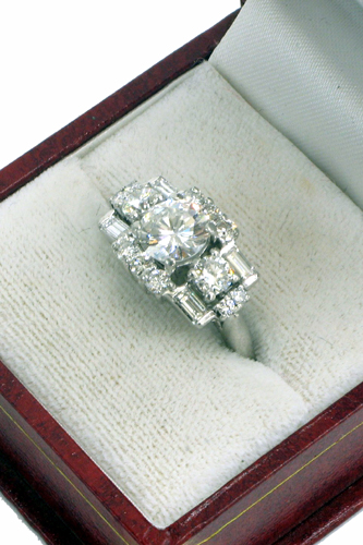 Appraisal: ESTATE DIAMOND AND PLATINUM RING WITH APPRAISAL Centering a round