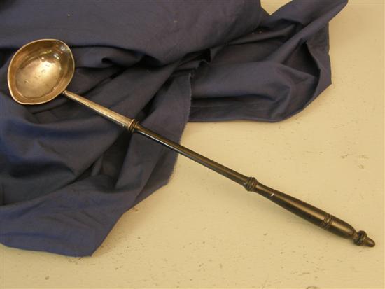 Appraisal: George II silver ladle with turned wood handle London maker