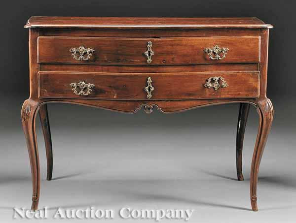 Appraisal: A Continental Carved Fruitwood Commode early th c serpentine top