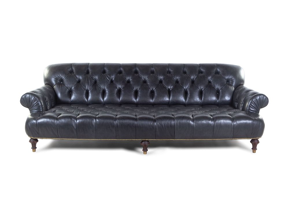 Appraisal: An Oversized Black Leather Upholstered Chesterfield Sofa An Oversized Black