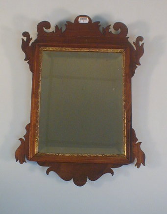 Appraisal: A George lll style walnut and parcel gilt mirror the