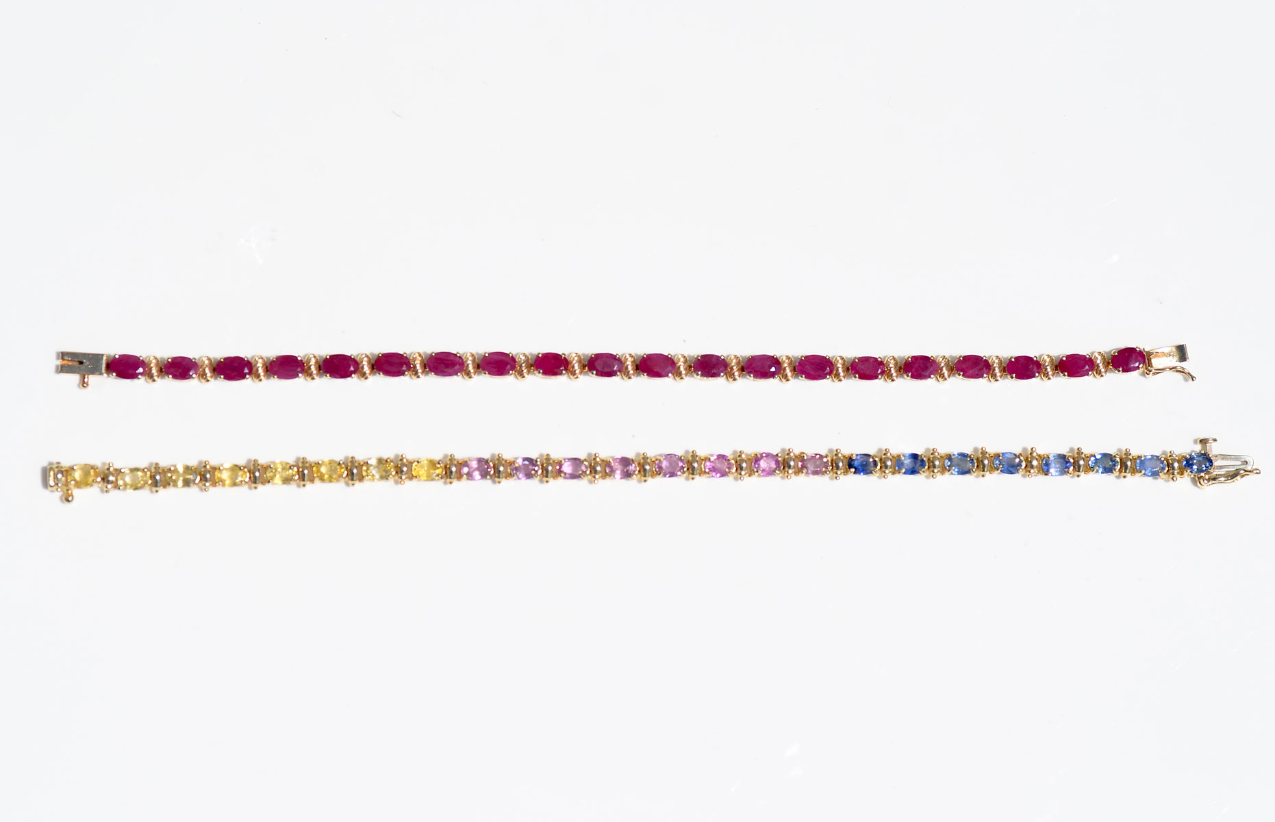 Appraisal: K GEMSTONE BRACELETS K yellow gold bracelet set with rubies