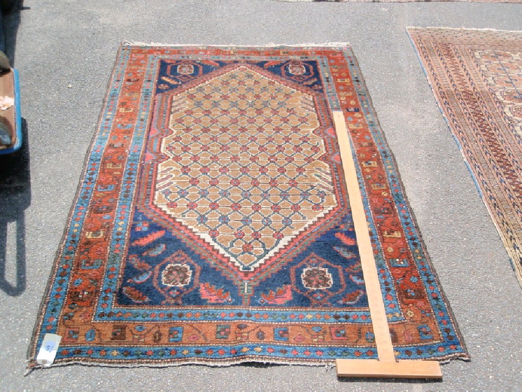 Appraisal: A Turkish design rug with beige ground central lozenge and