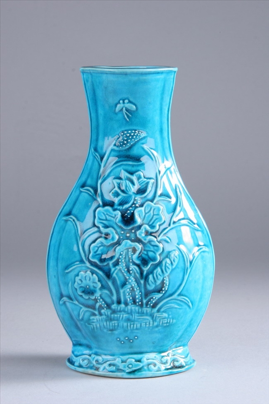 Appraisal: CHINESE TURQUOISE PORCELAIN VASE Qing Dynasty Molded to depict floral