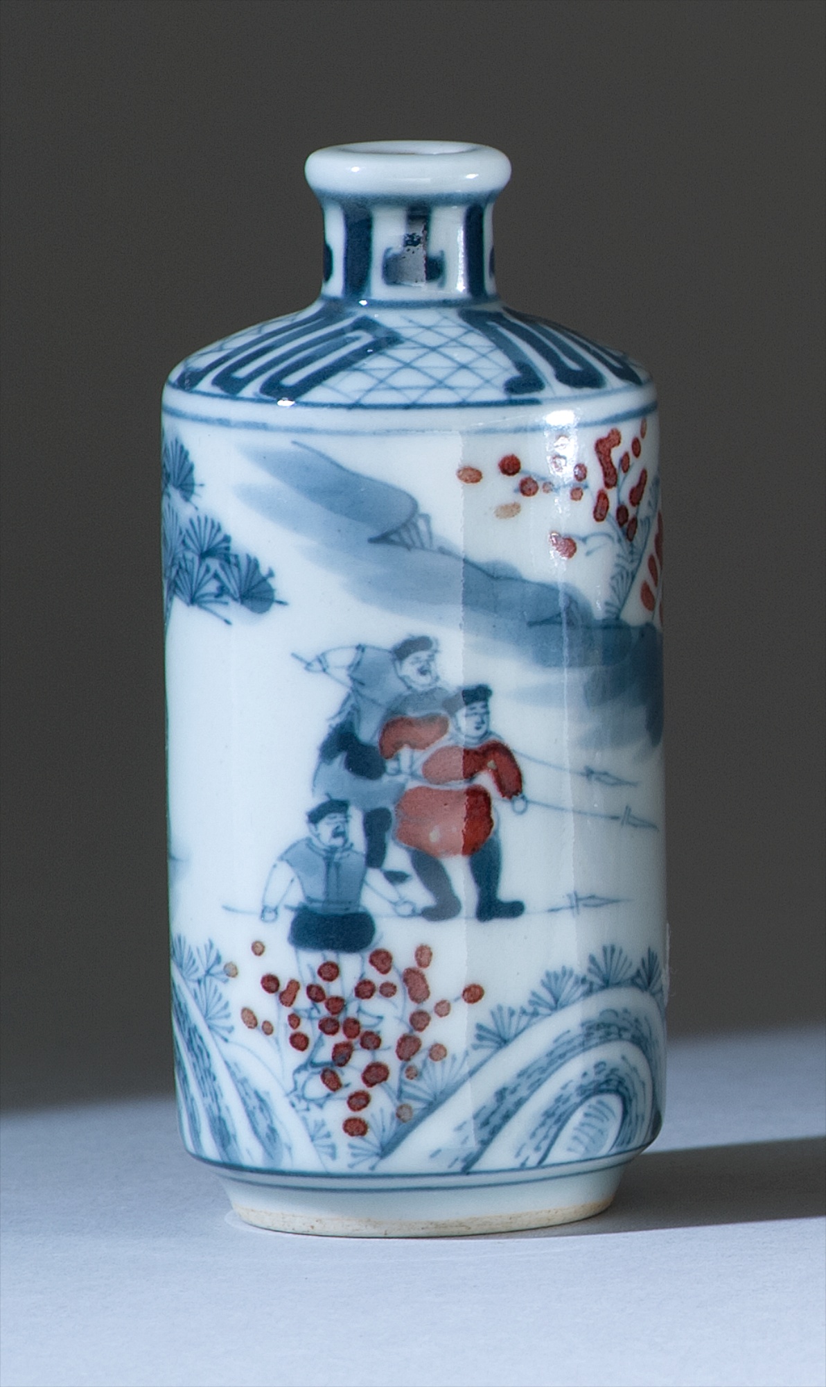 Appraisal: UNDERGLAZE RED AND BLUE PORCELAIN SNUFF BOTTLE th CenturyIn cylinder