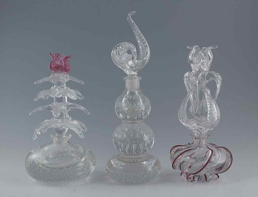 Appraisal: PAIRPOINT PERFUME BOTTLES WITH STOPPERS To include Cranberry swirl base