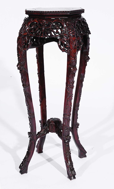 Appraisal: A Chinese rosewood octagonal urn stand th Centurywith inset marble