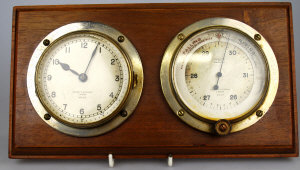 Appraisal: An early th clock barometer pair by Negretti Zambra London