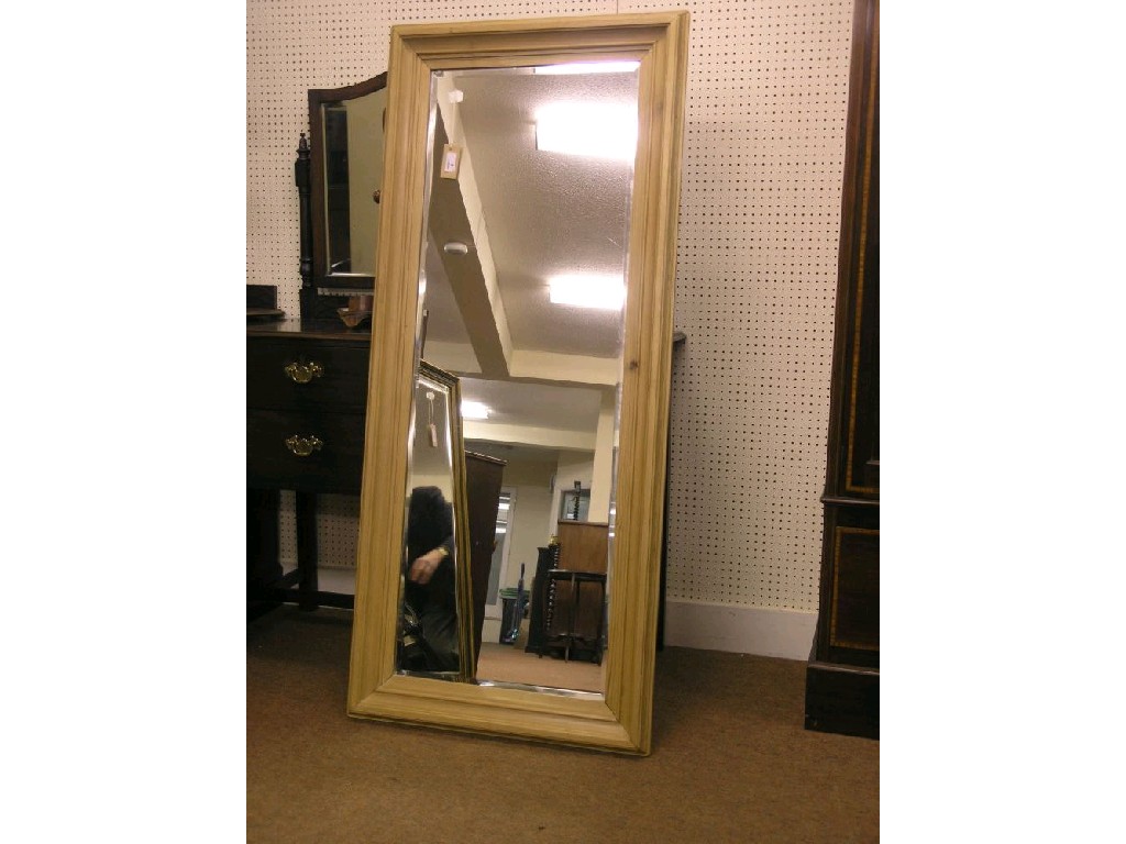 Appraisal: A waxed pine mirror moulded frame bevelled plate ft in