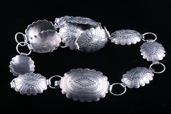 Appraisal: SOUTHWEST AMERICAN INDIAN STERLING CONCHA BELT Fourteen scalloped oval tooled