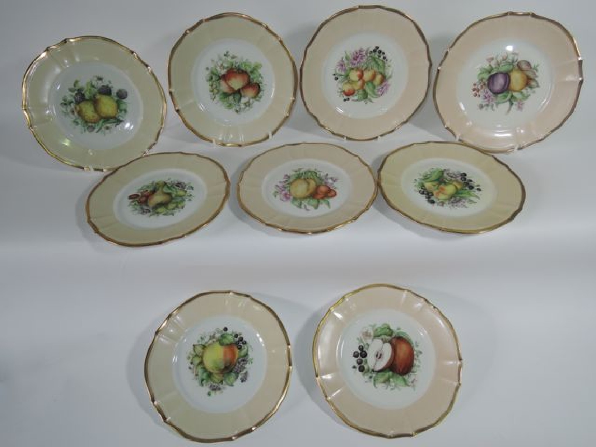 Appraisal: A set of nine continental dessert plates with various painted