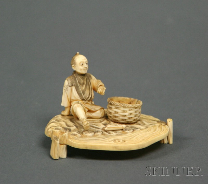 Appraisal: Ivory Carving Japan th century figure of a man with