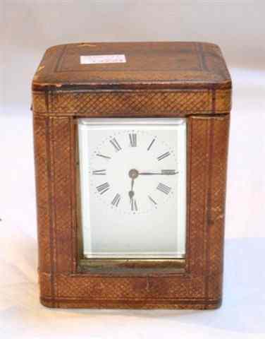 Appraisal: A FRENCH BRASS CASED CARRIAGE TIMEPIECE with white enamel dial